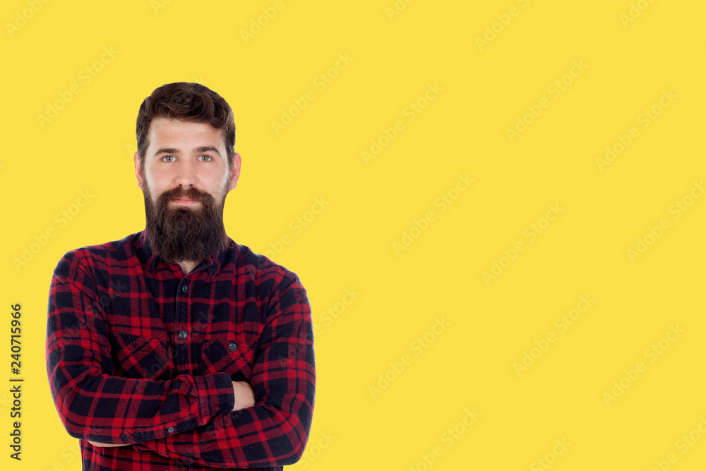 Hipster man with big beard on a yellow background Hipster man with big beard on a yellow background