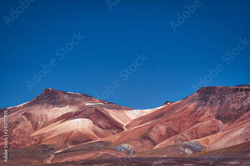 Dry arid mountains with red soil in the desert