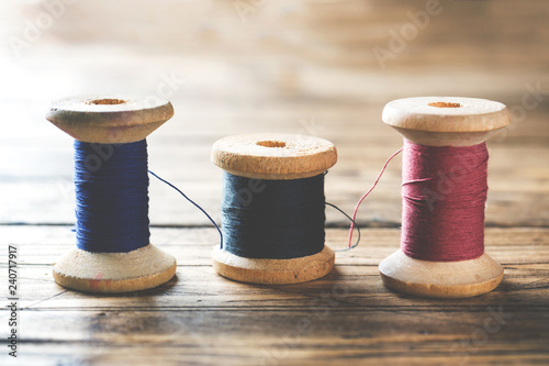 Wooden spools of thread close-up. Selective focus. Rendered image.