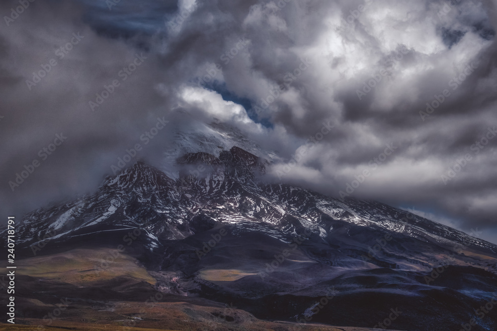 Steep mountain in dark clouds