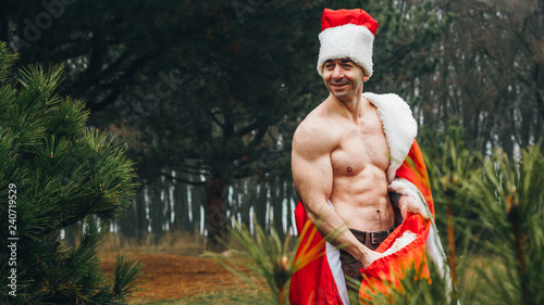 santa claus bodybuilder in the forest