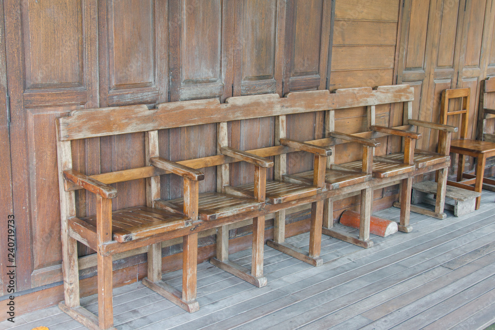 Wooden chairs are arranged in rows. Wooden chairs are arranged in rows.