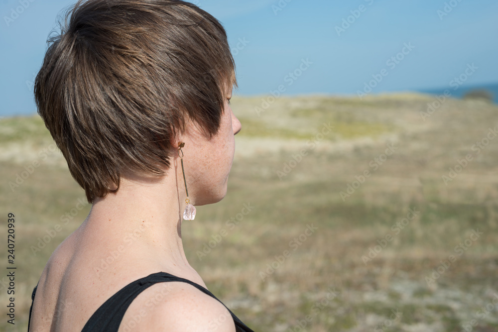 Female portrait in profile, short hair