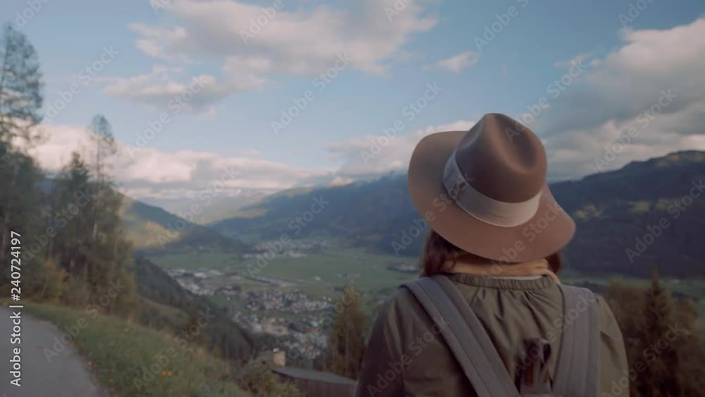 Young traveler with a backpack in the mountains of Austria Young traveler with a backpack in the mountains of Austria
