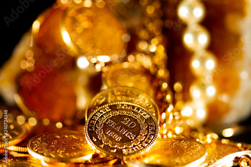 Gold coins over dark background