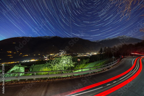 The car and star tails on the sky Motta  Italy.