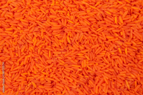 Orange rice from above view for texture backgrounds