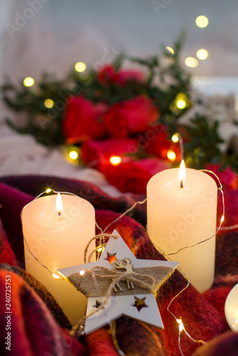 Composition  red roses with boxwood  candles  a garlands   red blanket and star.