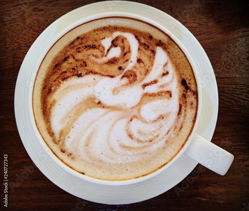 Silhouette of a swan in a coffee cup