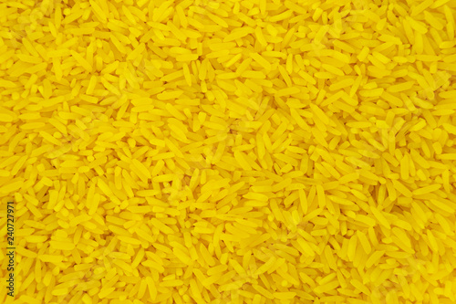 Yellow rice from above view for texture backgrounds