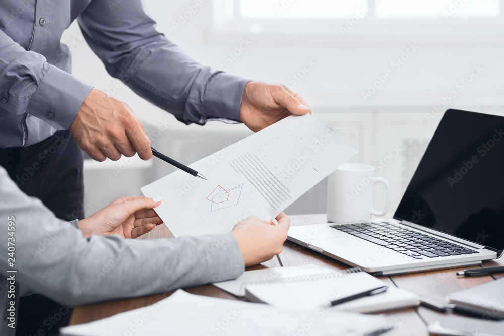 Analytical team working with financial results at meeting Analytical team working with financial results at meeting