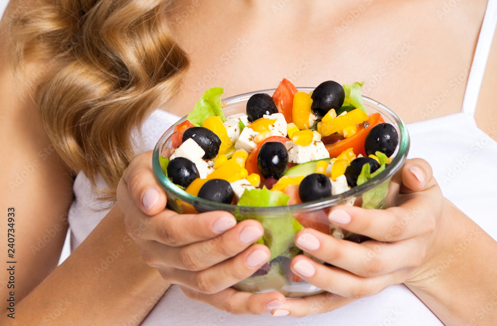 Woman with vegetarian salad, over gray Woman with vegetarian salad, over gray