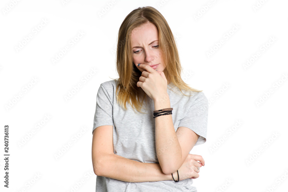 Portrait of a serious pensive woman isolated on white background. Portrait of a serious pensive woman isolated on white background.