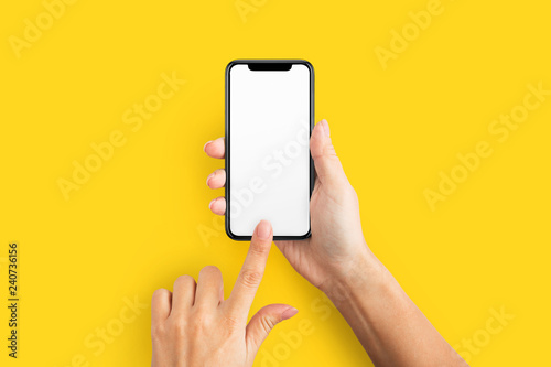 Mockup of female hand holding cell phone with blank screen photo
