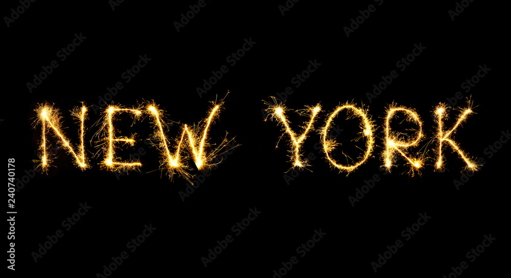 The city's name New York is written in sparklers fireworks. The city's name New York is written in sparklers fireworks.