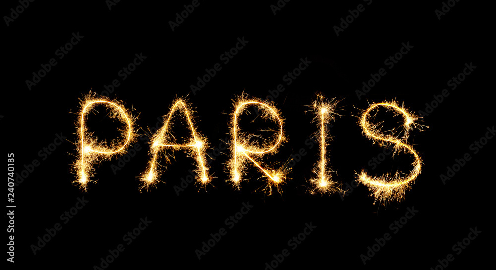 The city's name Paris is written in sparklers fireworks The city's name Paris is written in sparklers fireworks
