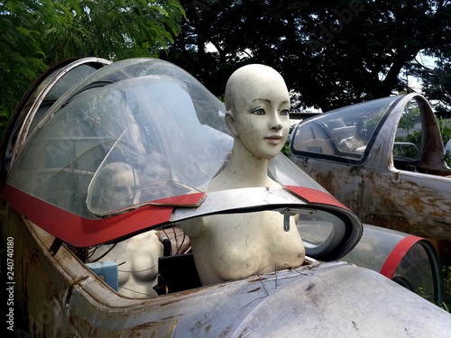 Life-size female mannequin on board of decaying plane photo