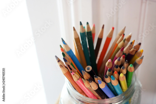 Brightly colored jar of sharpened pencils 