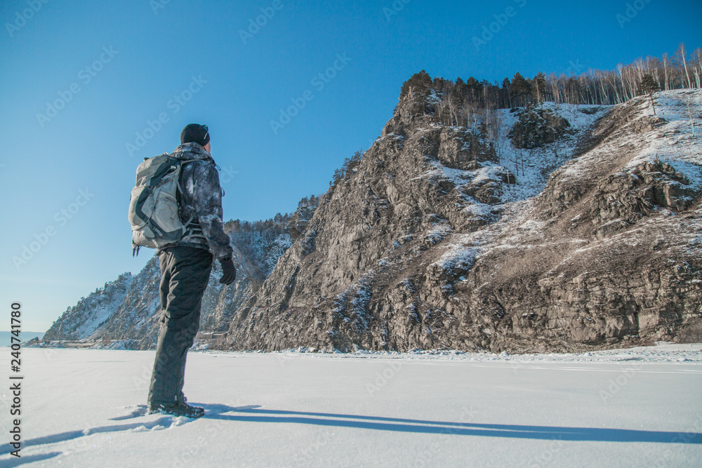 Man hiking on ice. Winter Landscape. Man hiking on ice. Winter Landscape.