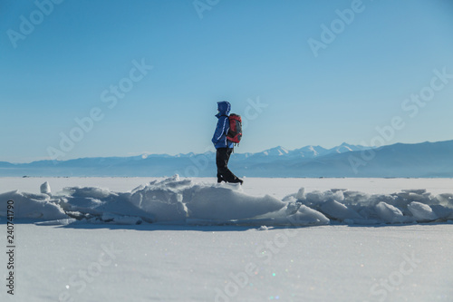 Man hiking on ice. Winter Landscape.