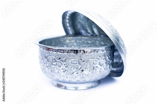 Close up of white or silver colored shiny container isolated on white. photo