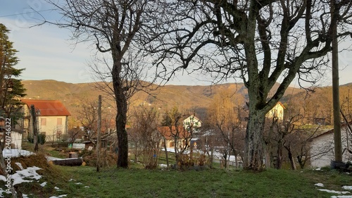 Beautiful caption of some snow on the village before christmas and some small country houses in the hills of Liguria