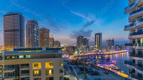 An Aerial view of Dubai Marina Towers in Dubai day to night timelapse