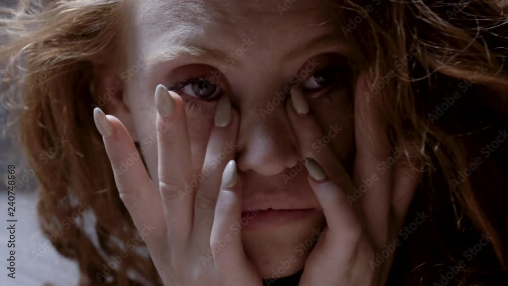 sad troubled woman look at the camera sad troubled woman look at the camera