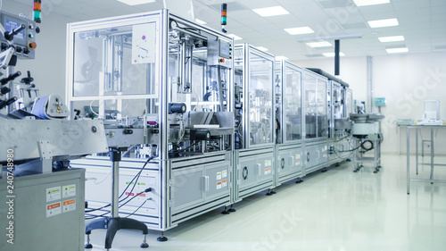 Shot of Sterile Precision Manufacturing Laboratory with 3D Printers, Super Computers and other Electrical Equipment and Machines suitable for Pharmaceutics, Biotechnology and Semiconductor Researches. photo