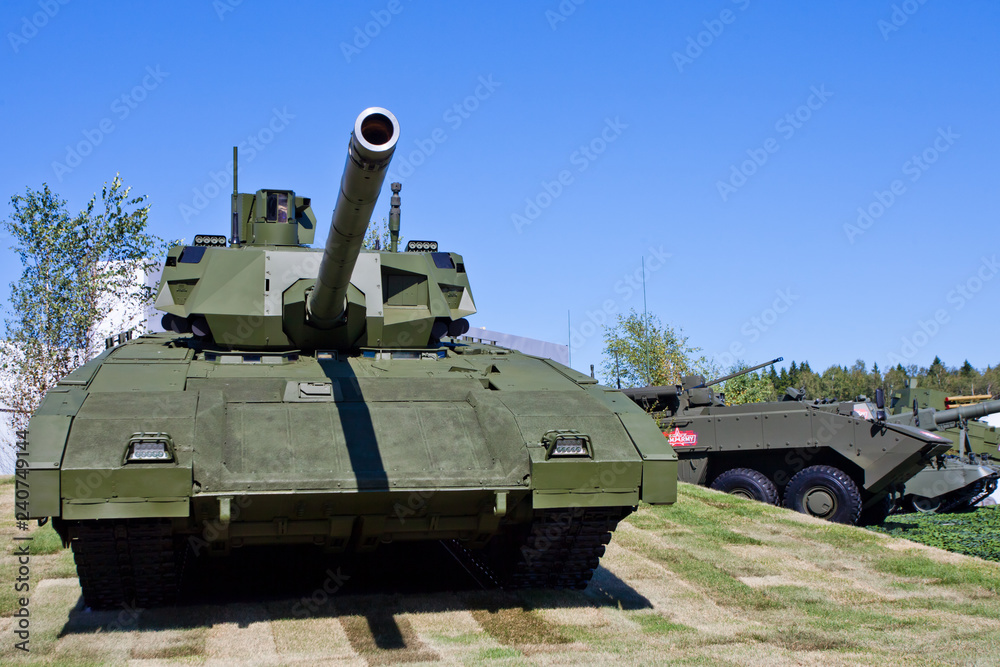 T-14 Armata tank at the military exhibition. tank in front, space for text. T-14 Armata tank at the military exhibition. tank in front, space for text.