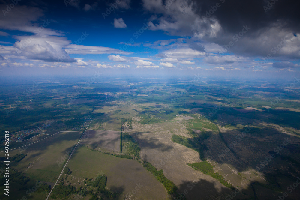 The flight under the blue sky over the summer plain. The flight under the blue sky over the summer plain.