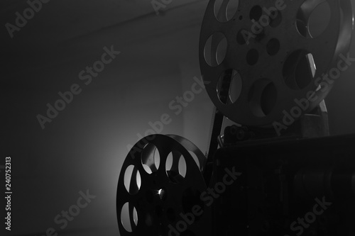 Vintage movie projector. Film reels. Black and white. Still life, close-up