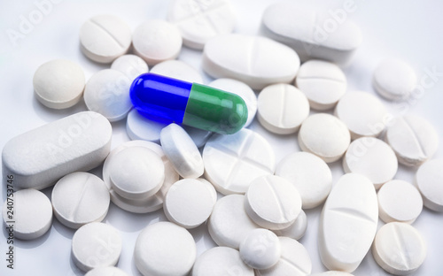 Capsule blue and green on some tablets are white, conceptual image