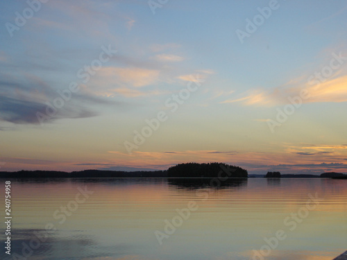 Sunset landscape of Kuopio lakes reflection on the water and nice colors © Maria
