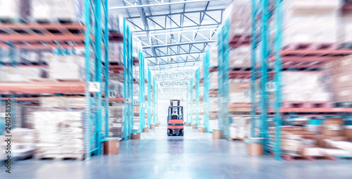 warehouse metal structure interior with  forklift truck in selective focus photo
