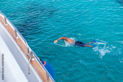 Top view of people snorkeling in the sea. Holiday and travel concept