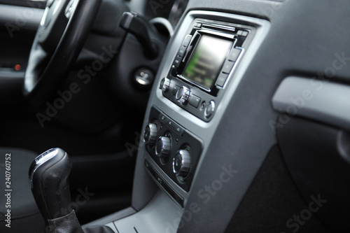 controls near the steering wheel in a modern car © ruslan_shramko