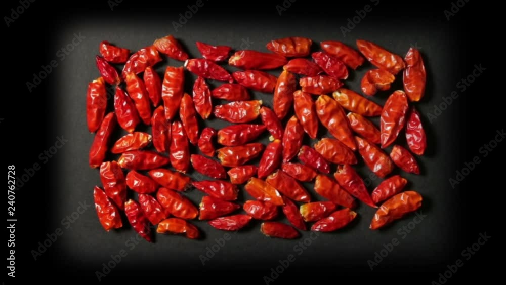 Some spicy red peppers, grouped in rectangular shape on a black plane, in zoom-in. Some spicy red peppers, grouped in rectangular shape on a black plane, in zoom-in.