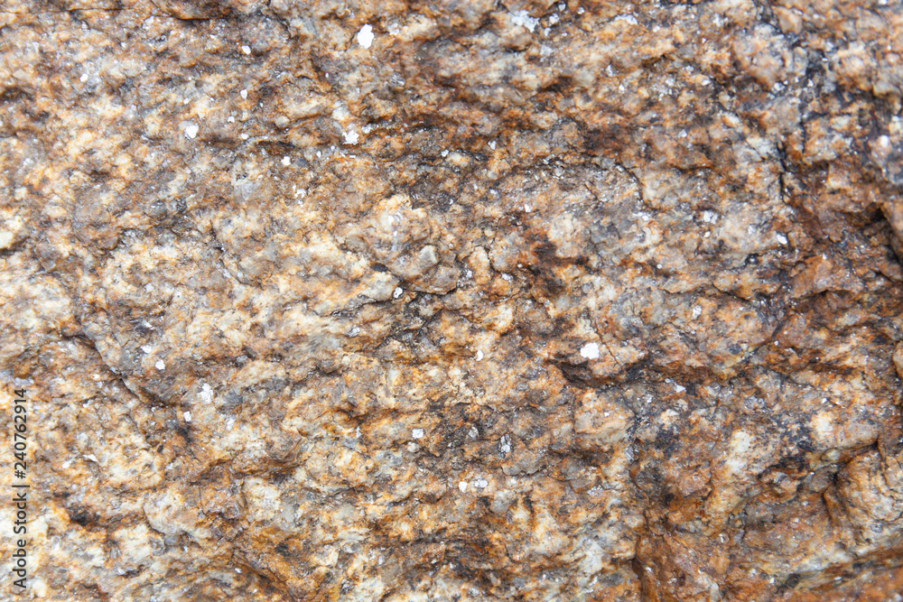 Abstract nature grunge texture background of dark brown granite rock with detail, rough and rustic. Abstract nature grunge texture background of dark brown granite rock with detail, rough and rustic.