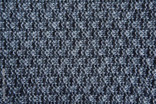 Dark grey knitting wool texture background. Knitting or knitted background close up view