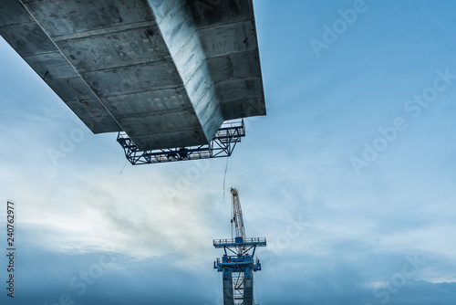 Crown Princess Marys bridge hangs in the air connecting to the next pylon photo