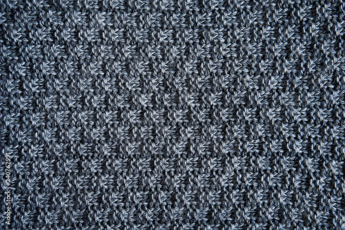 Dark grey knitting wool texture background. Knitting or knitted background close up view