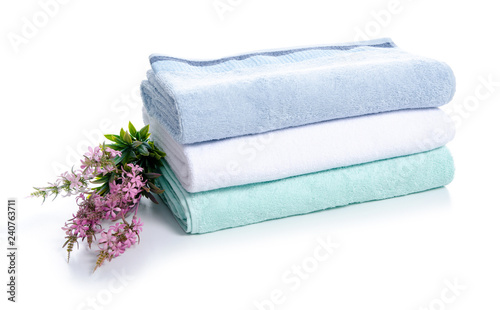 Stack towels flowers soft on white background isolation