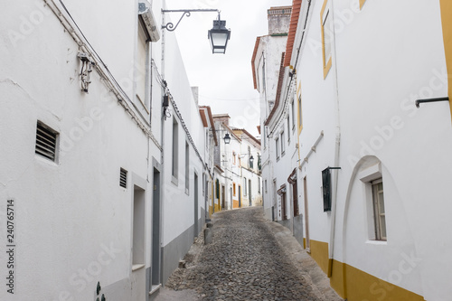 Narrow cobble-stoned street in Évora, Portugal