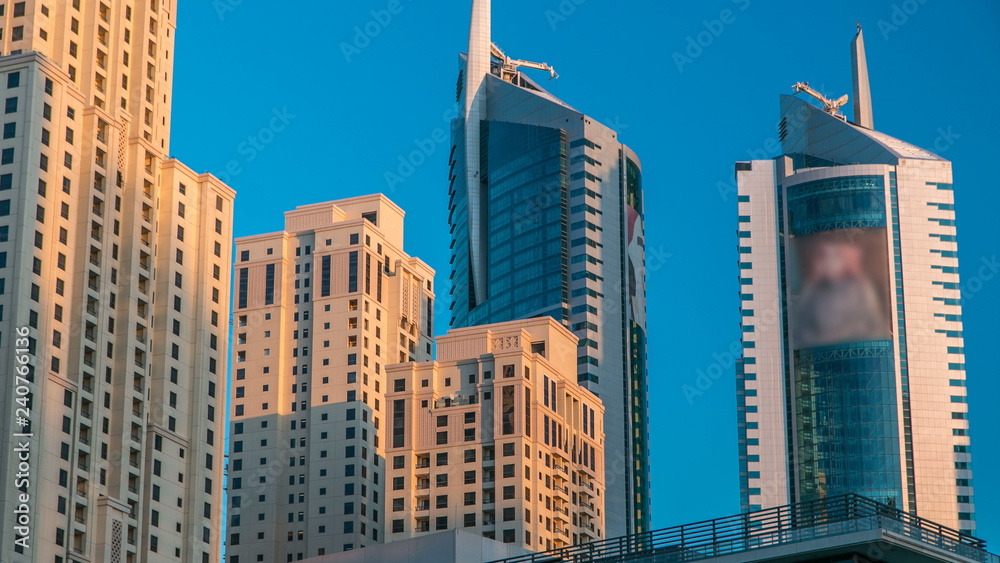 Fototapeta premium Morning view of Dubai Marina Towers in Dubai timelapse