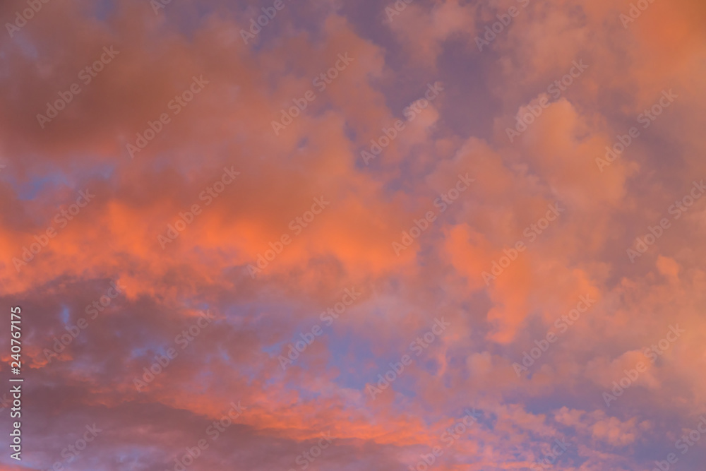 Dramatic clouds at colourful moody sunset