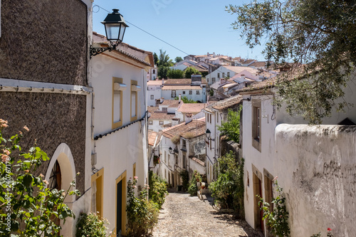 View down a narrow cobblestone street in the Jewish district of Castelo de Vide  Alentejo  Portugal