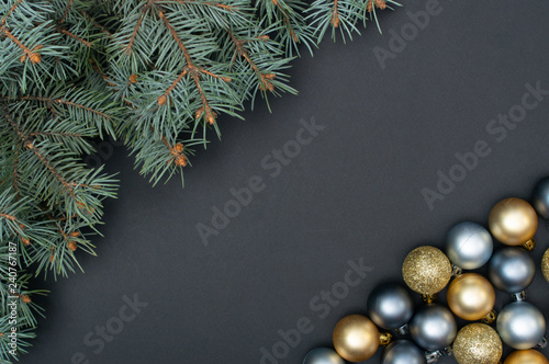 Multiple Christmas silver and gold baubles creative decoration pattern with pine tree branches