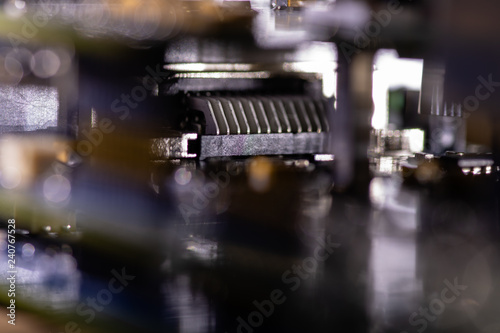 Tableau sur toile Close up (Macro) of Printed Circuit Board PCB embedded components (inductors, resistors, capacitors, diodes, microchips, transistor) with short depth of view
