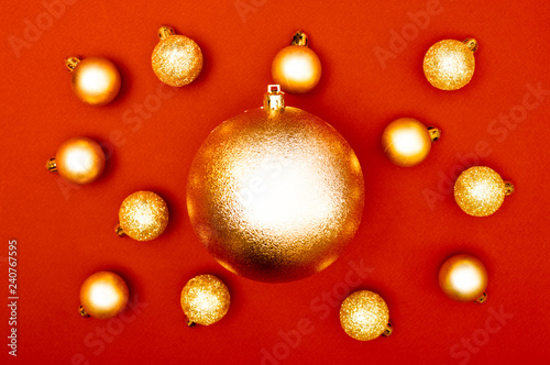 Multiple Christmas baubles creative decoration pattern on the red background. Concept.